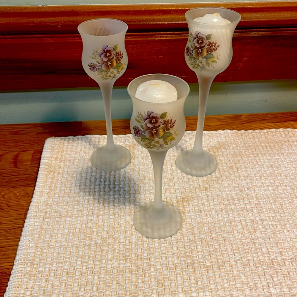 Frosted floral votive holders.  In graduated sizes